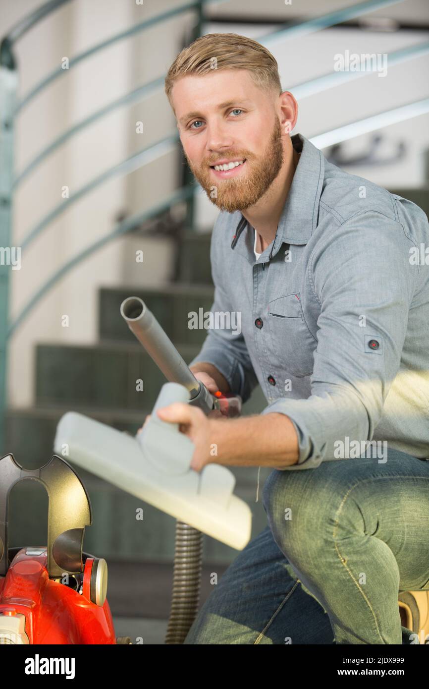 man preparing a vacuum cleaner Stock Photo