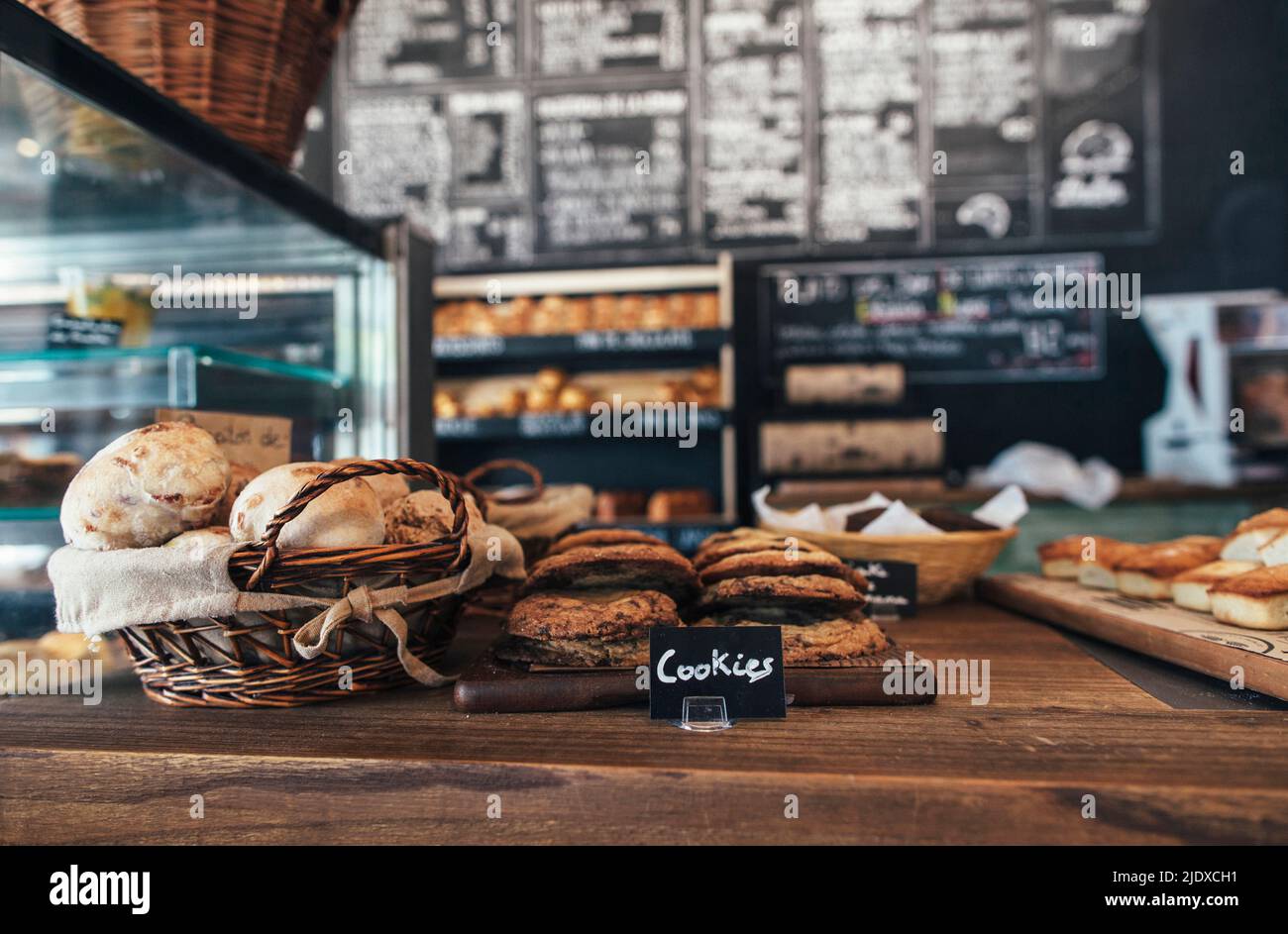 Fresh assortment of cookies and breads on table in bakery Stock Photo