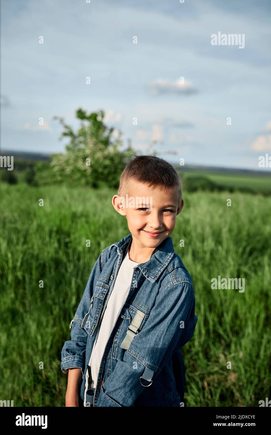 Boy standing in field hi-res stock photography and images - Alamy