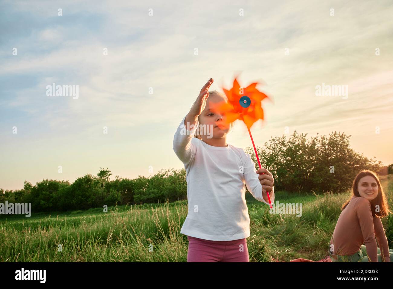 Children playing pinwheel in field hi-res stock photography and images ...