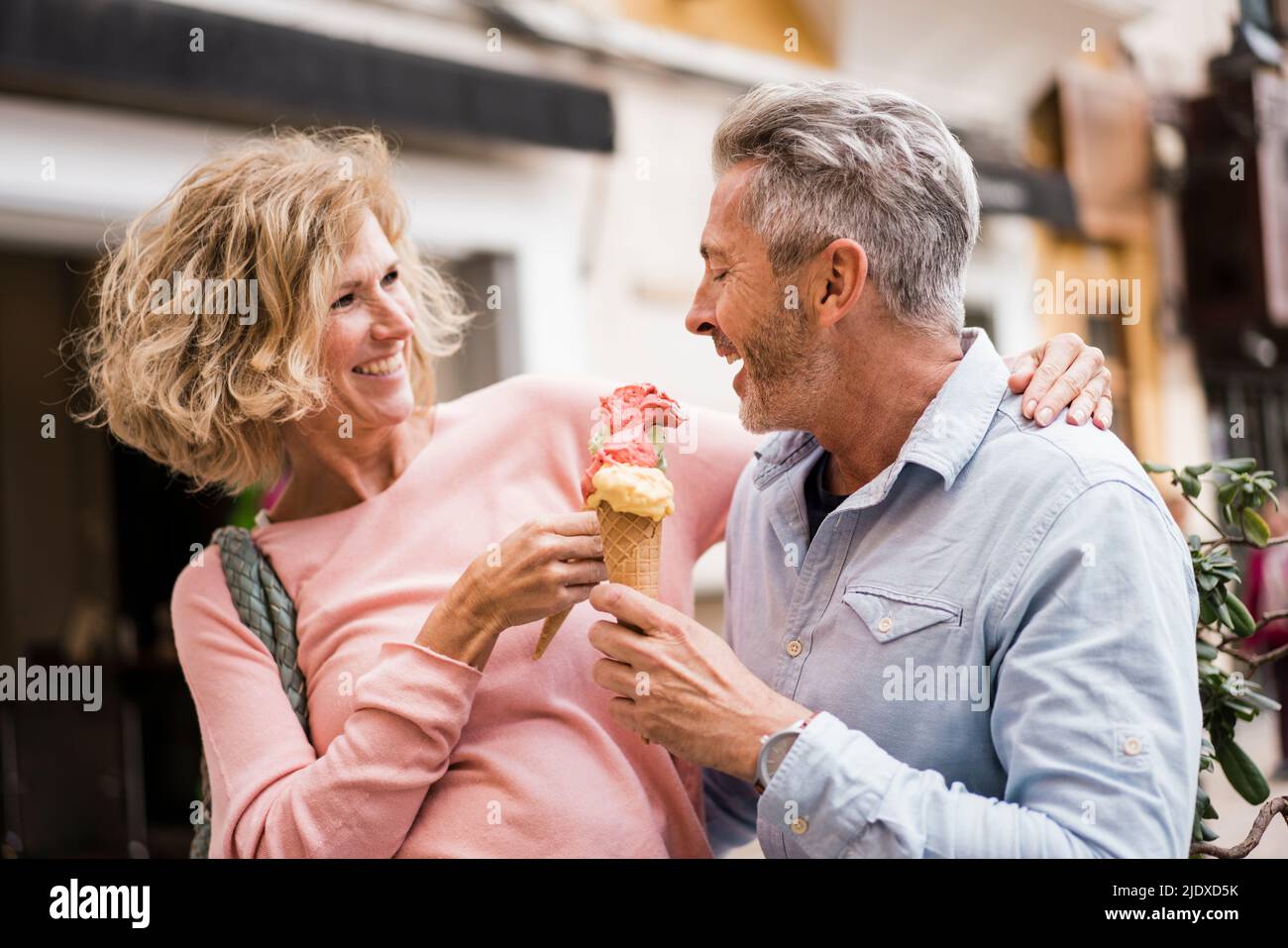 Happy mature tourists having ice cream Stock Photo