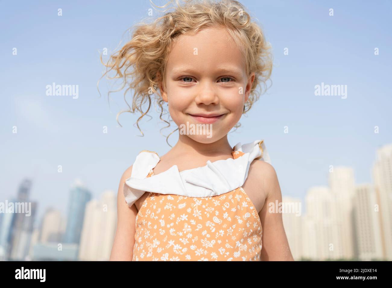 Happy girl with blond hair on sunny day Stock Photo
