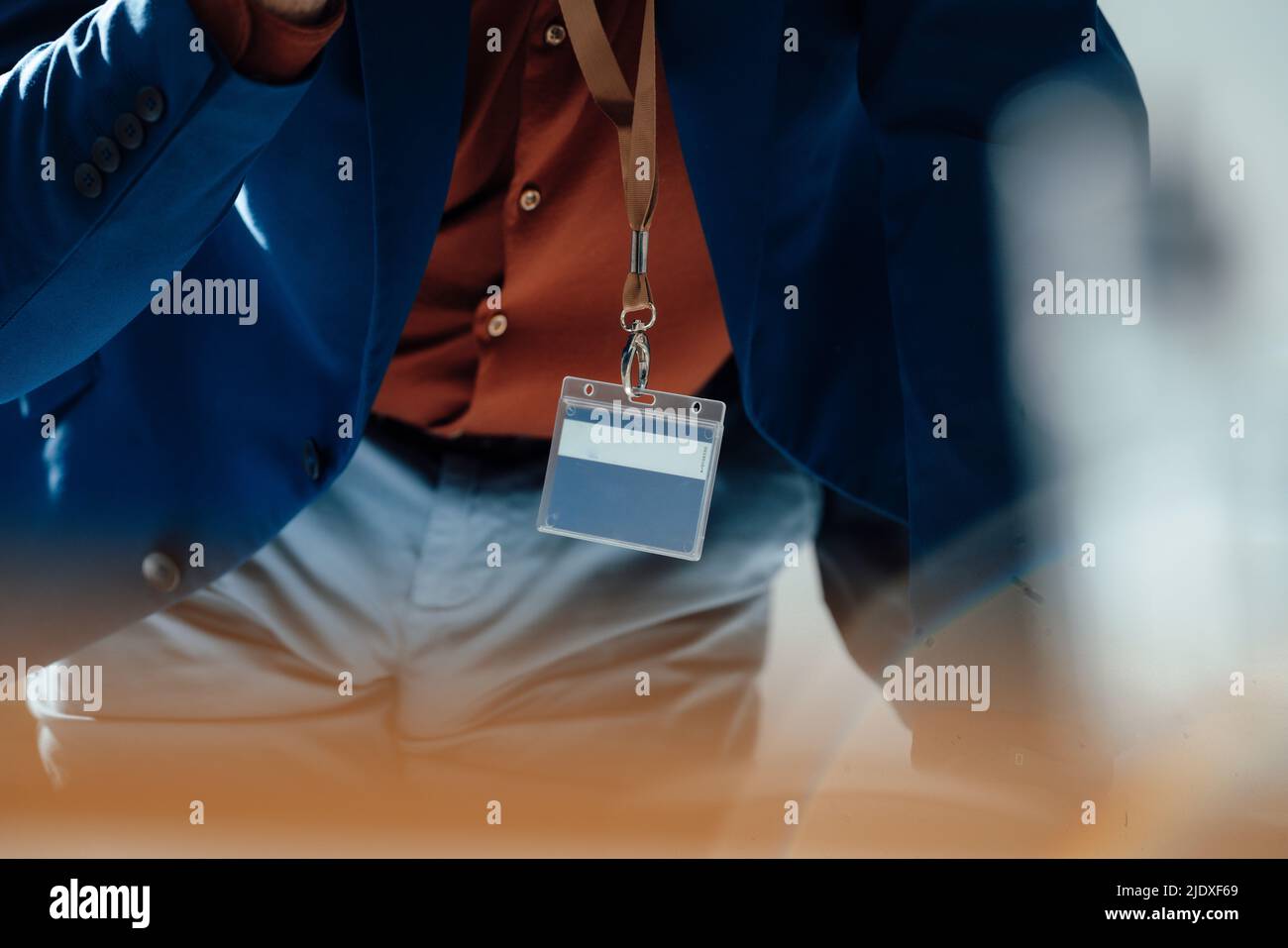 Senior businessman wearing ID card at office Stock Photo