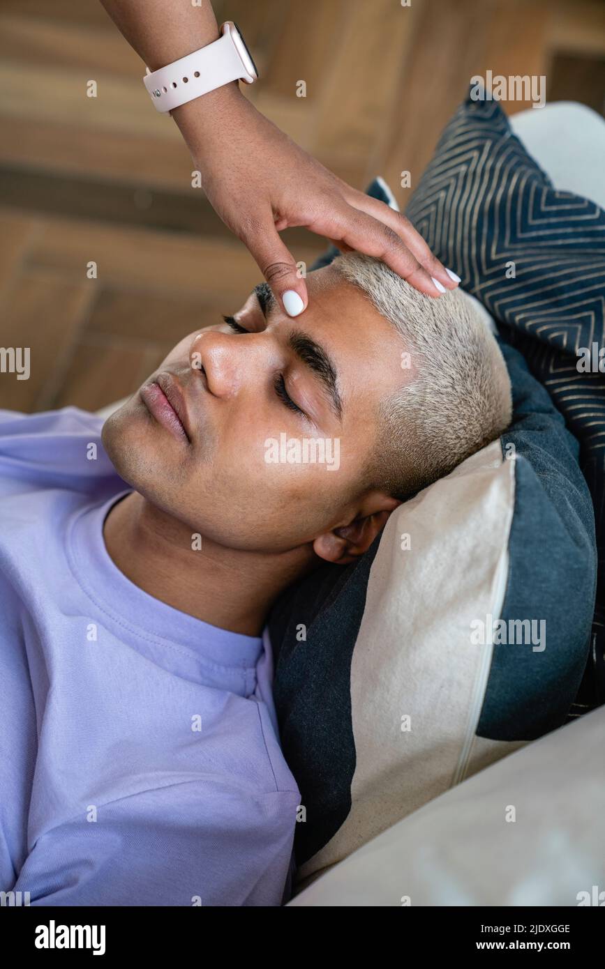 Hand of psychologist doing hypnosis therapy on patient Stock Photo