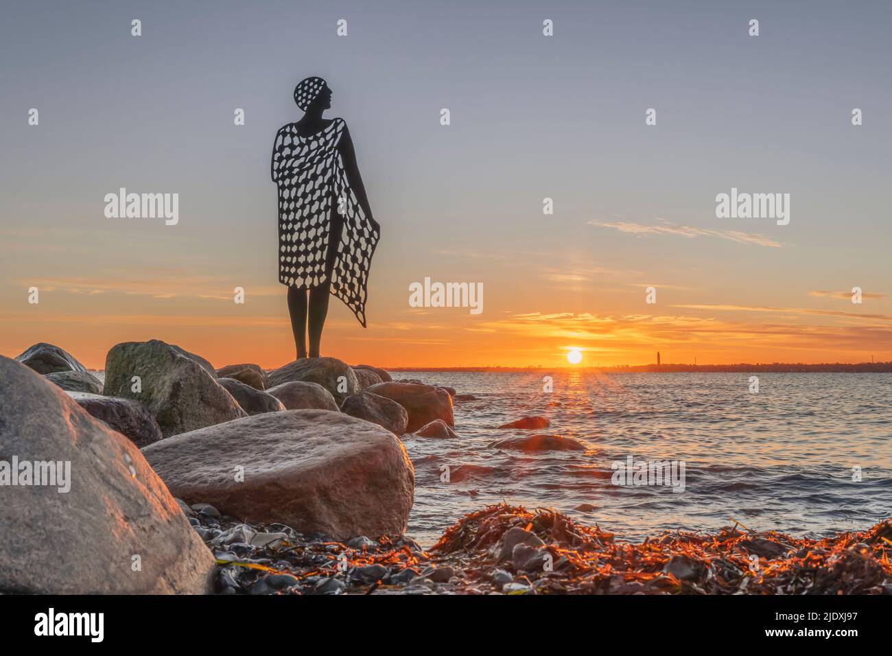 Germany, Schleswig-Holstein, Strande, After Bath statue at sunset Stock Photo