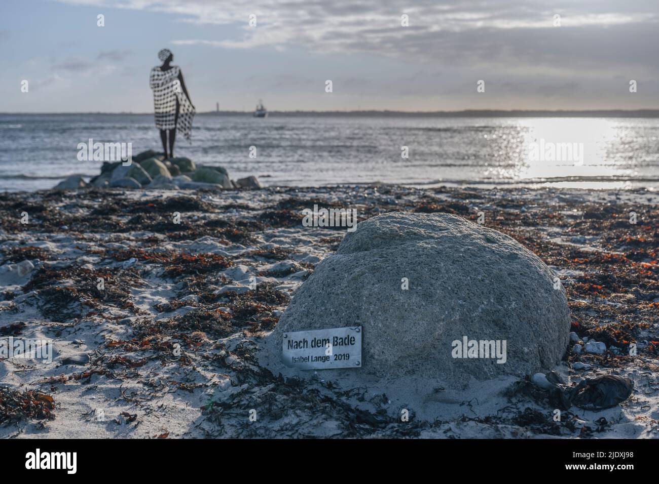 Germany, Schleswig-Holstein, Strande, Information sign in front of After Bath statue by Isabel Lange Stock Photo