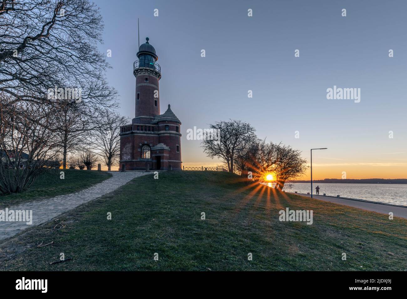 Germany, Schleswig-Holstein, Kiel, Lighthouse overlooking Kiel Canal at sunrise Stock Photo