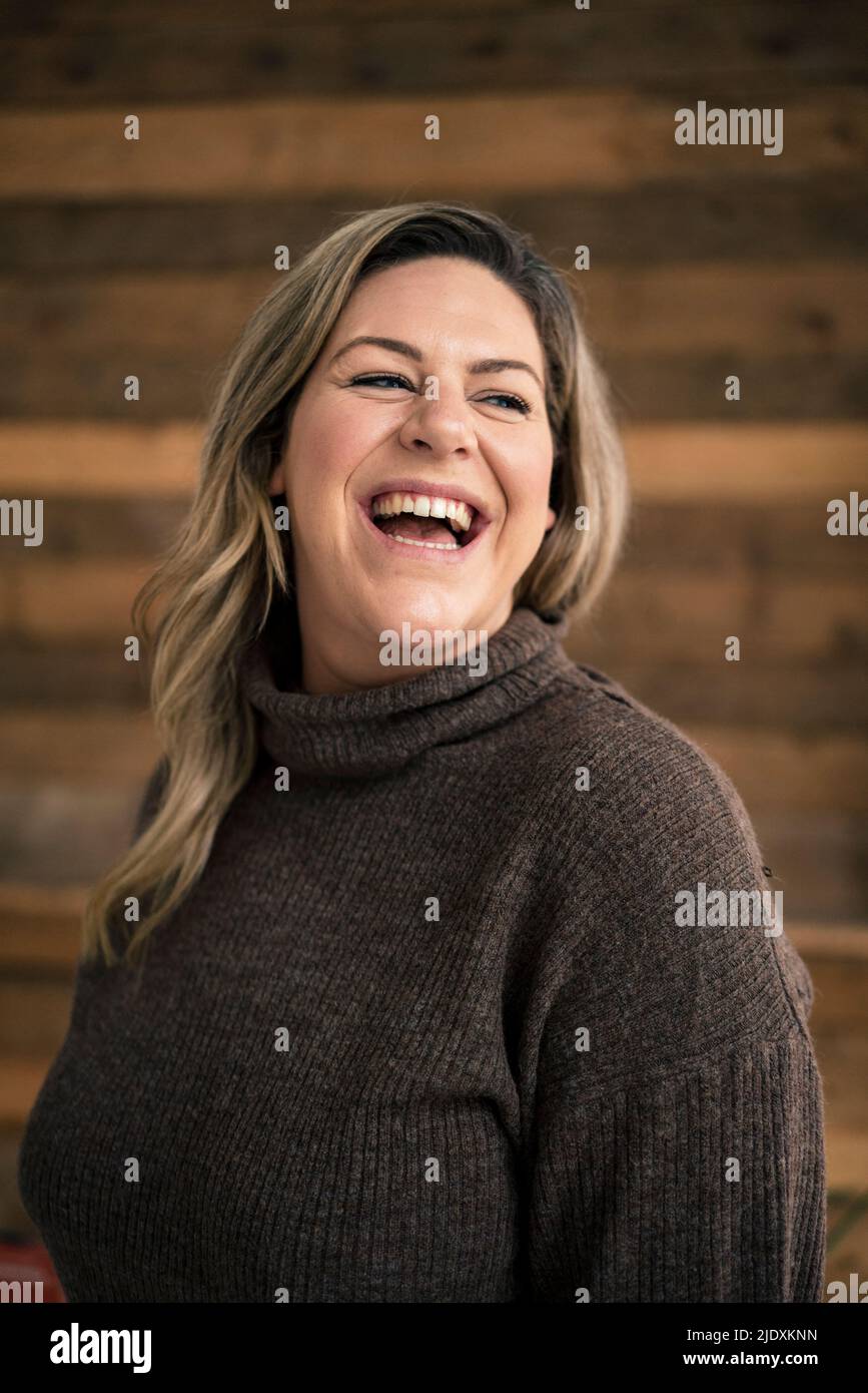 Cheerful plus size woman at home Stock Photo