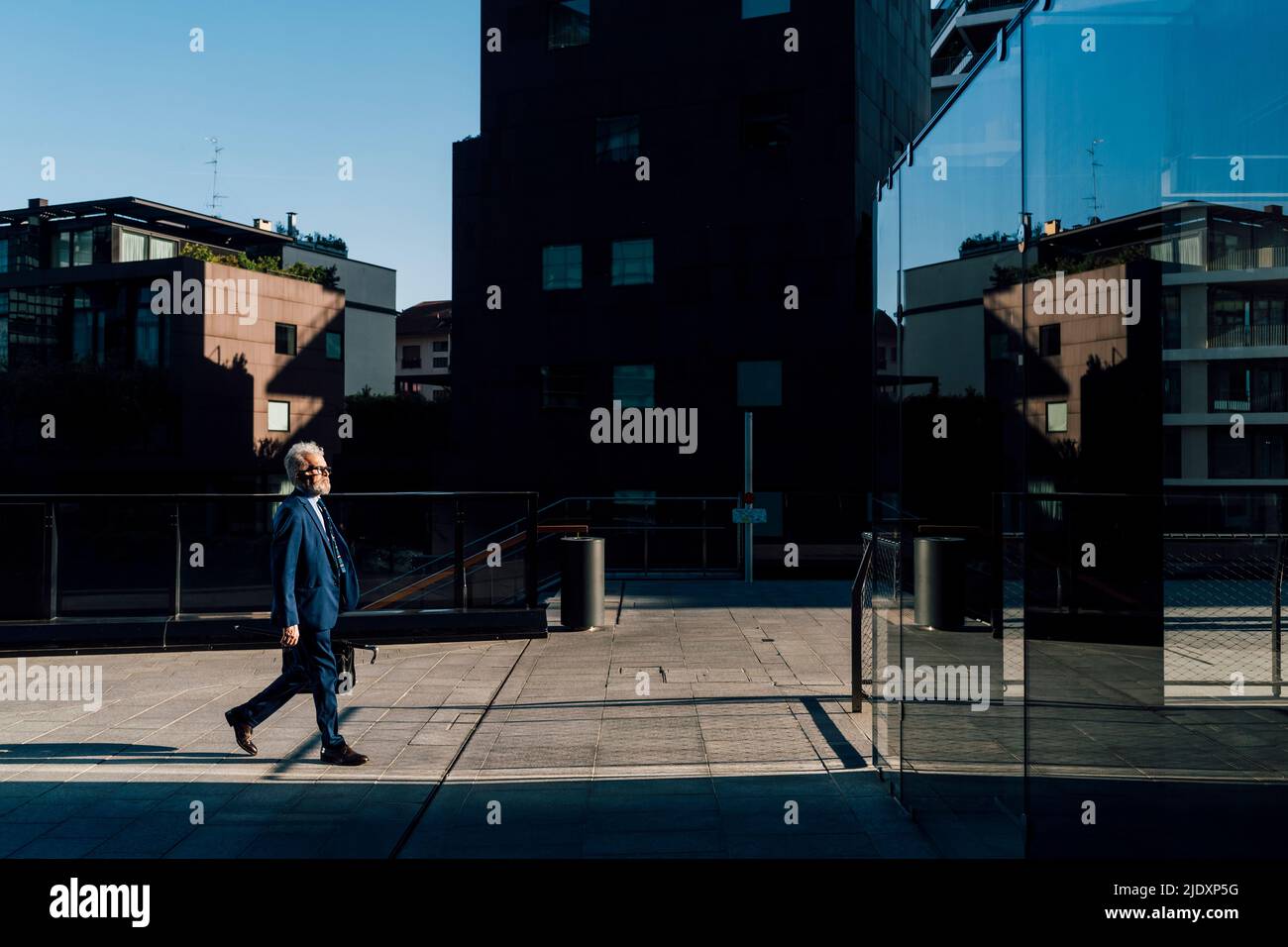 Senior man walking outside hi-res stock photography and images - Alamy