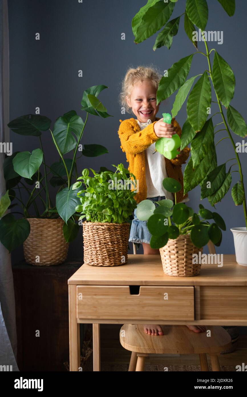 Child watering plants bottle hires stock photography and images Alamy