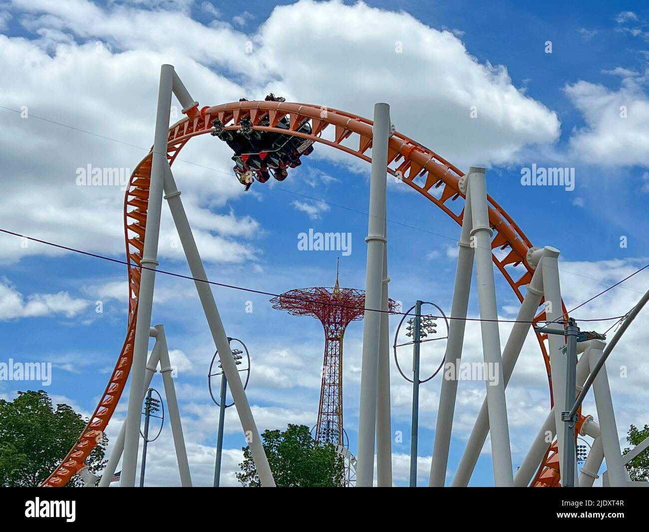 People ride the fast moving Thunderbolt roller coaster at Coney Island, Brooklyn, New York. Stock Photo