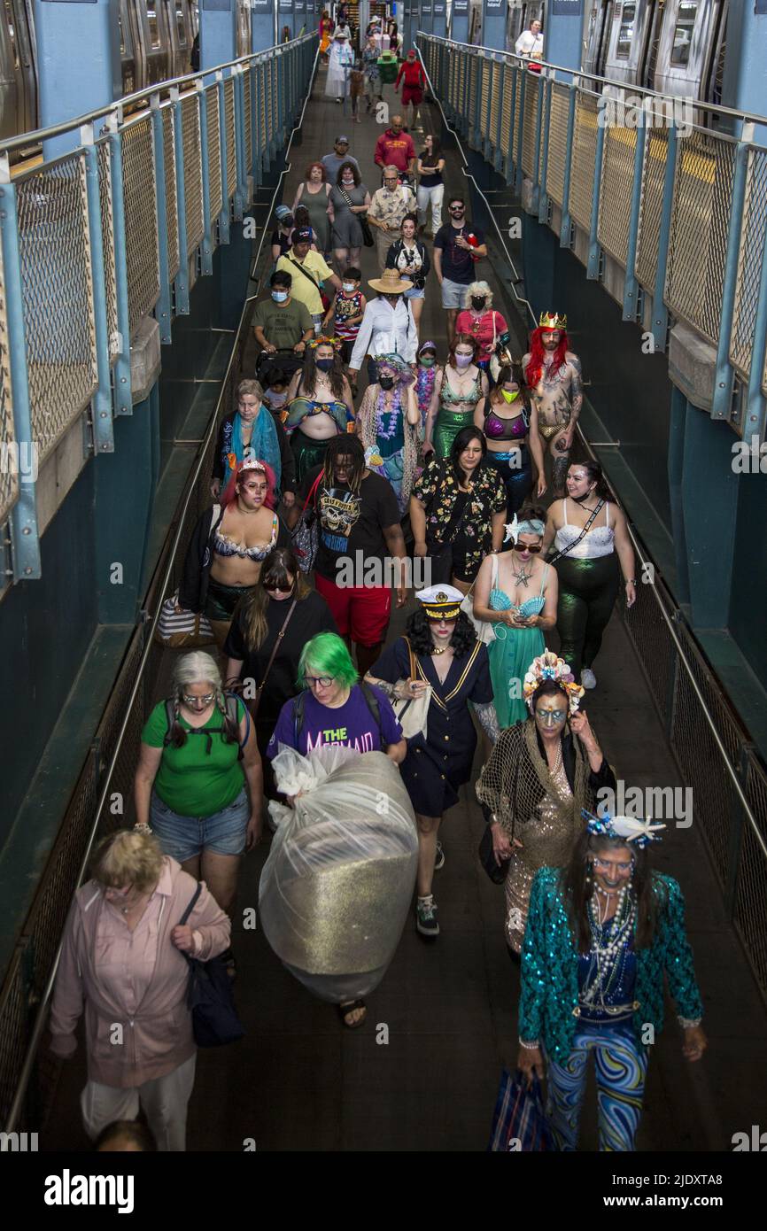 After 2 years from a Covid-19 shutdown, people return to the annual Mermaid Parade, alleged to be the largest art parade in the nation, at Coney Island along Surf Avenue in Brooklyn, New York. Parade goers eit the subway station at Stillwell Avenue. Stock Photo