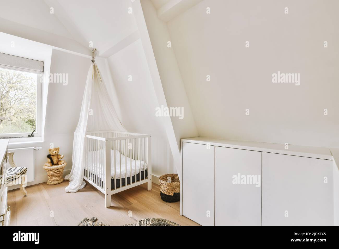 Interior Of A Modern Children S Bedroom With A Bunk Bed, A Chest Of Drawers And A Table With A