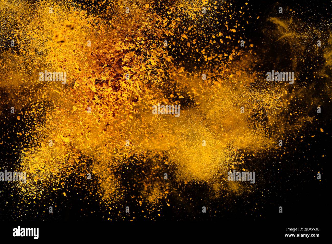 Explosion, Splashes of turmeric on a black background. India Seasoning ...