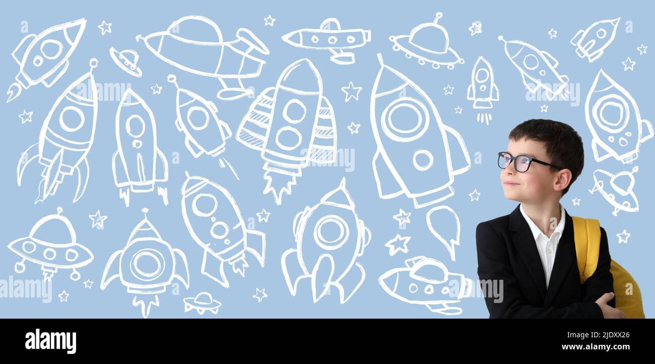 Little schoolboy on light blue background with drawn rockets Stock ...