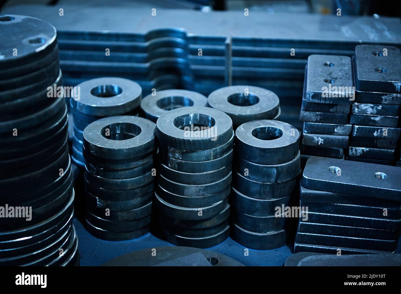 Stacks of different shape workpieces for detail making Stock Photo