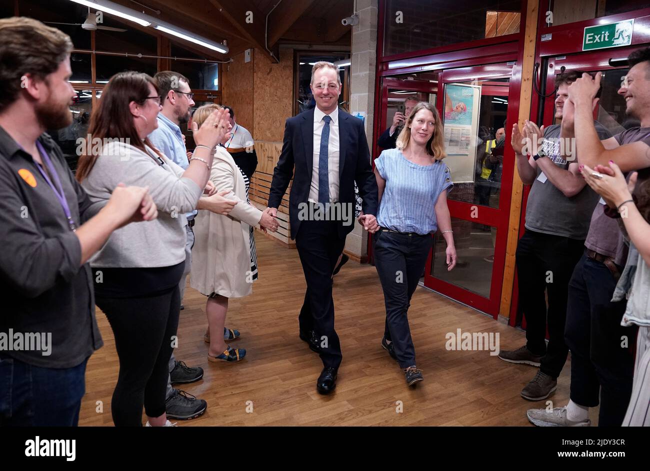The Liberal Democrats' by-election candidate Richard Foord and his wife Kate are greeted by supporters as they arrive at the Lords Meadow Leisure Centre, in Crediton, Devon for the result of the Tiverton and Honiton by-election, which was triggered by the resignation of MP Neil Parish for watching pornography in the Commons. Picture date: Friday June 24, 2022. Stock Photo
