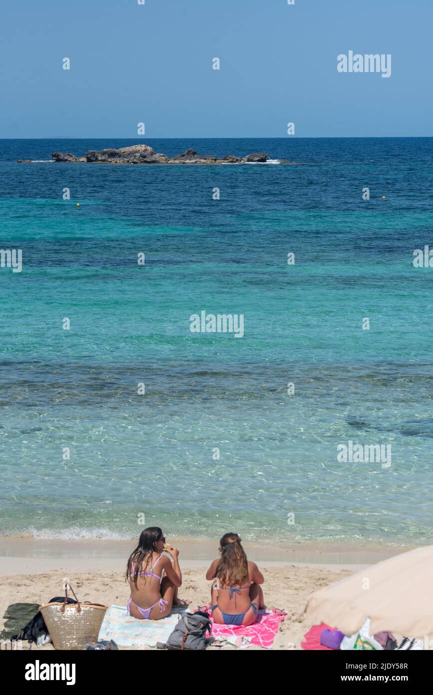 Formentera, Spain: July 11, 2021: People on the beach at Es Pujols beach in Formentera in summer 2021 Stock Photo