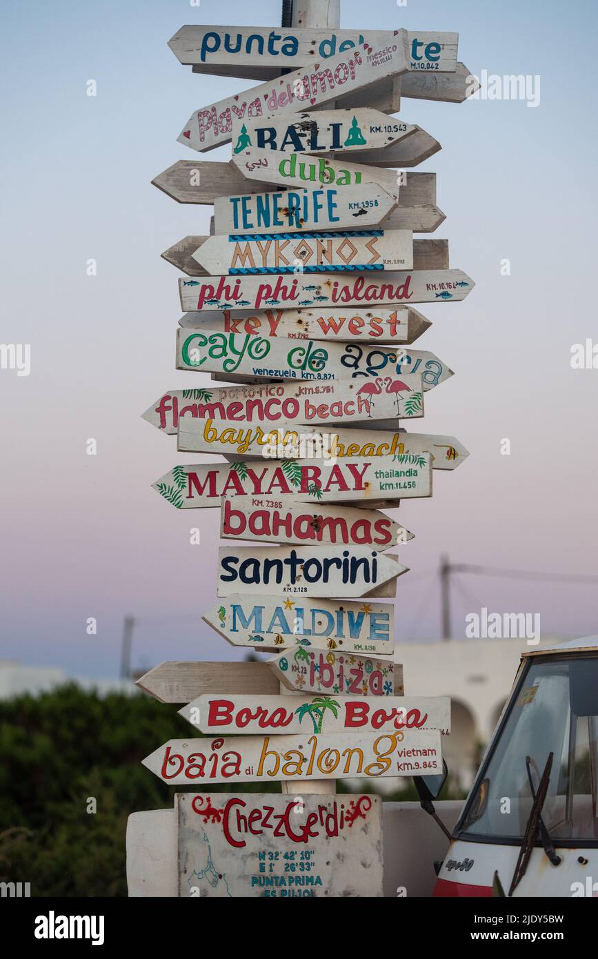 Signal post distances to paradic cities of the world in Formentera, Spain. Stock Photo