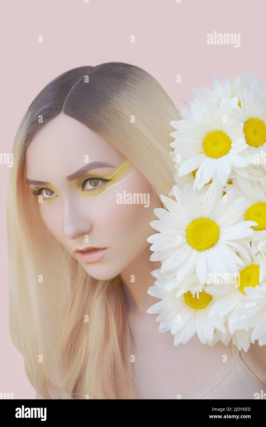 Asian Girl With Camomile Flowers Stock Photo