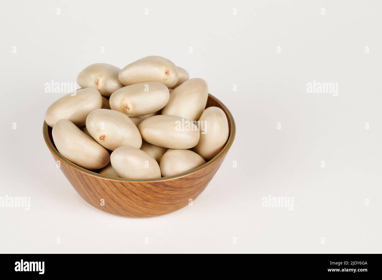 Closeup view of Bowl containing jackfruit seeds (artocarpus heterophyllus) on a white background Stock Photo