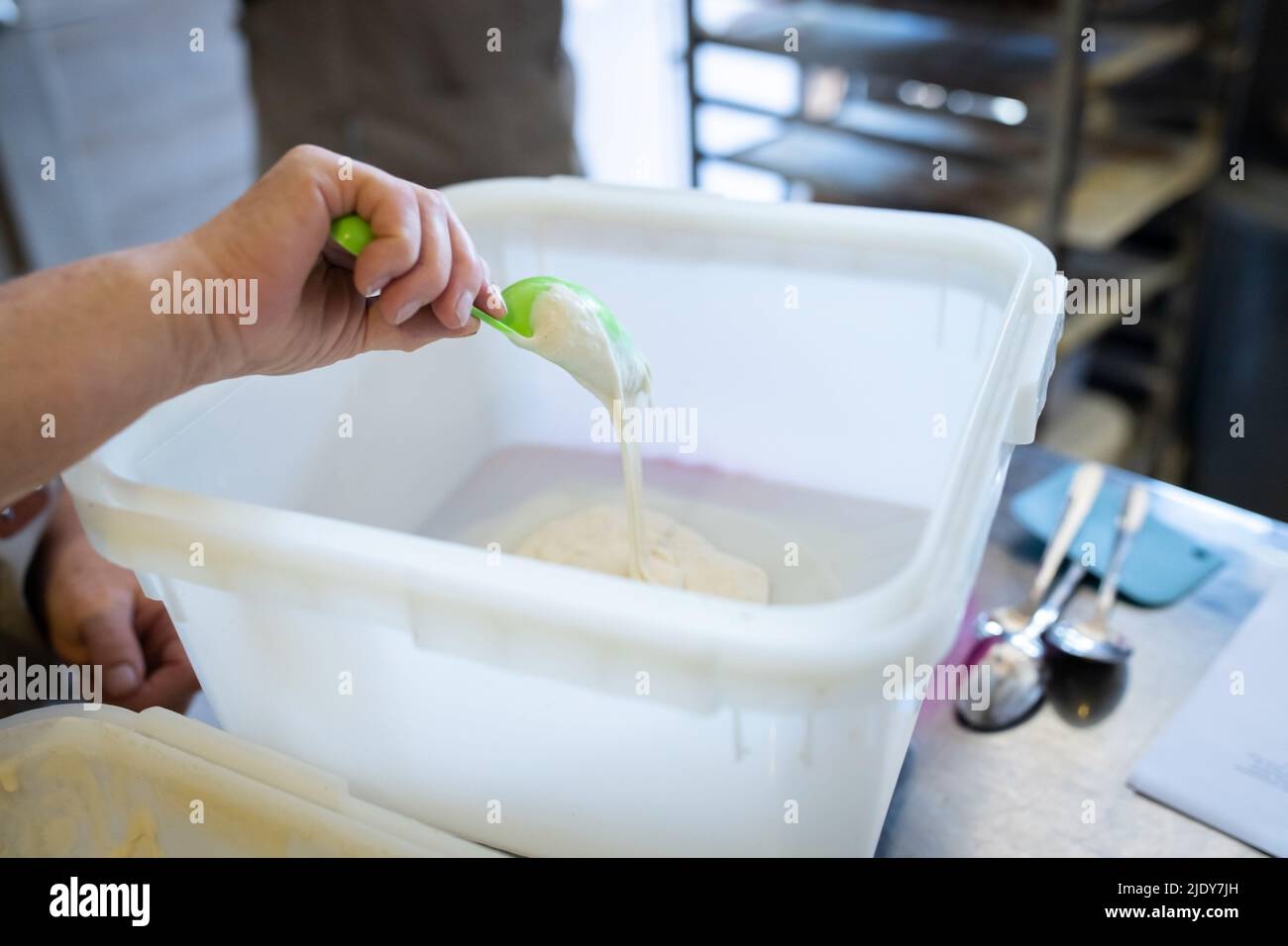 The process of making wheat bread. Sourdough is added to the mixing