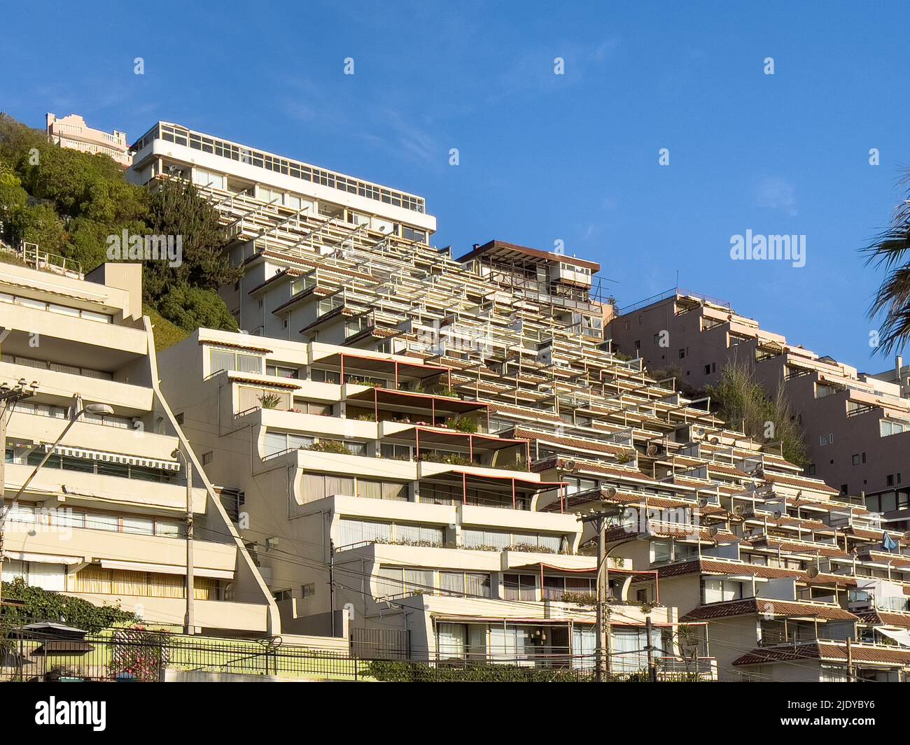 Sunny apartment buildings on hill mountain in Reñaca coast, Chile