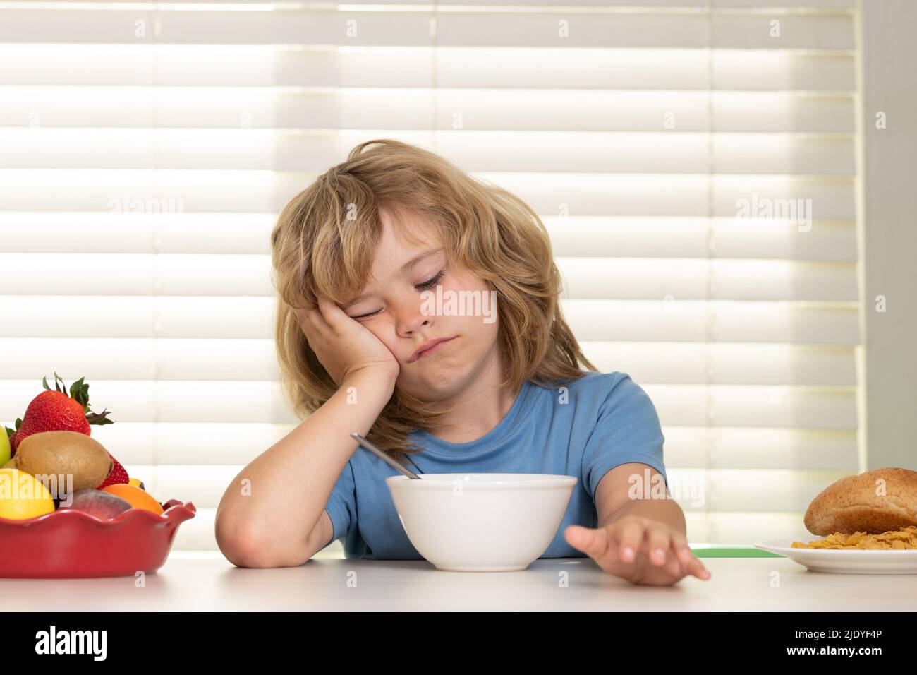 Portrait of kid with no appetite. Concept of loss of appetite