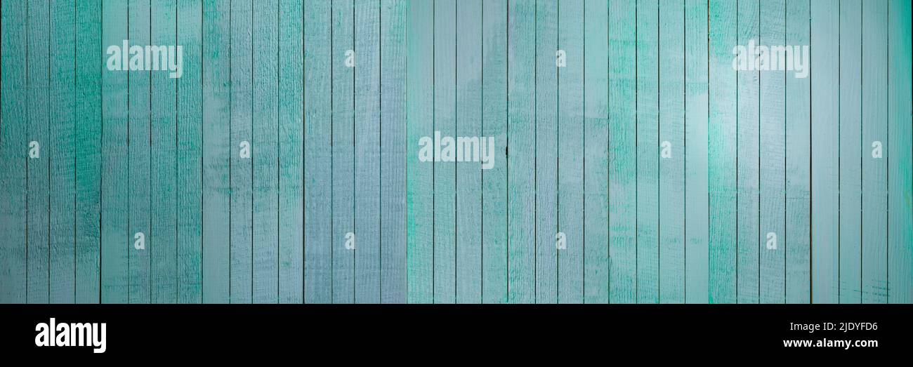 Light blue wood background - Aquamarine planks with peeling paint in vertical wood - Turquoise wooden surface Stock Photo