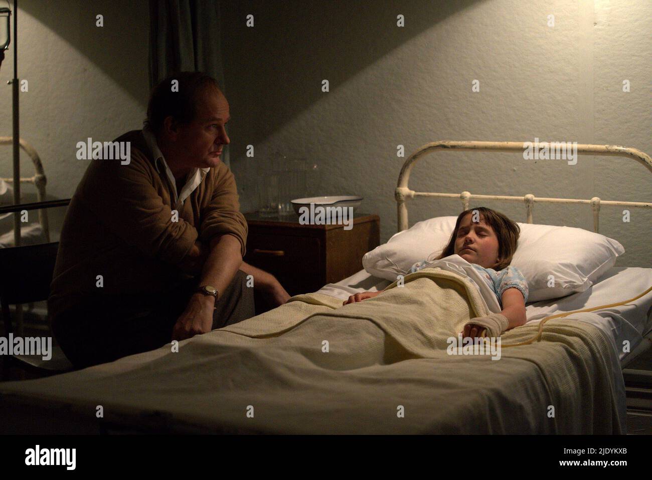 HUGH BONNEVILLE and DARCEY EWART in TO OLIVIA (2021), directed by JOHN