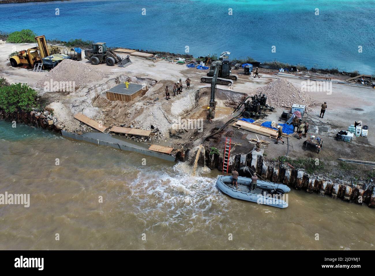 Northern Mariana Islands. 9th June, 2022. Personnel assigned to Underwater Construction Team (UCT) 2 and Naval Mobile Construction Battalion (NMCB) 3 Detachment Tinian complete repair work to demolish and reconstruct a Roll-on, Roll-off Discharge Facility (RRDF) in Tinian Harbor. This type of capability will enable logistics throughput where conventional port facilities are not available. This is one of many projects ongoing by Navy Expeditionary Combat Command during Exercise Valiant Shield 2022. Exercises such as Valiant Shield allow the Indo-Pacific Command Joint Forces the opportunity t Stock Photo