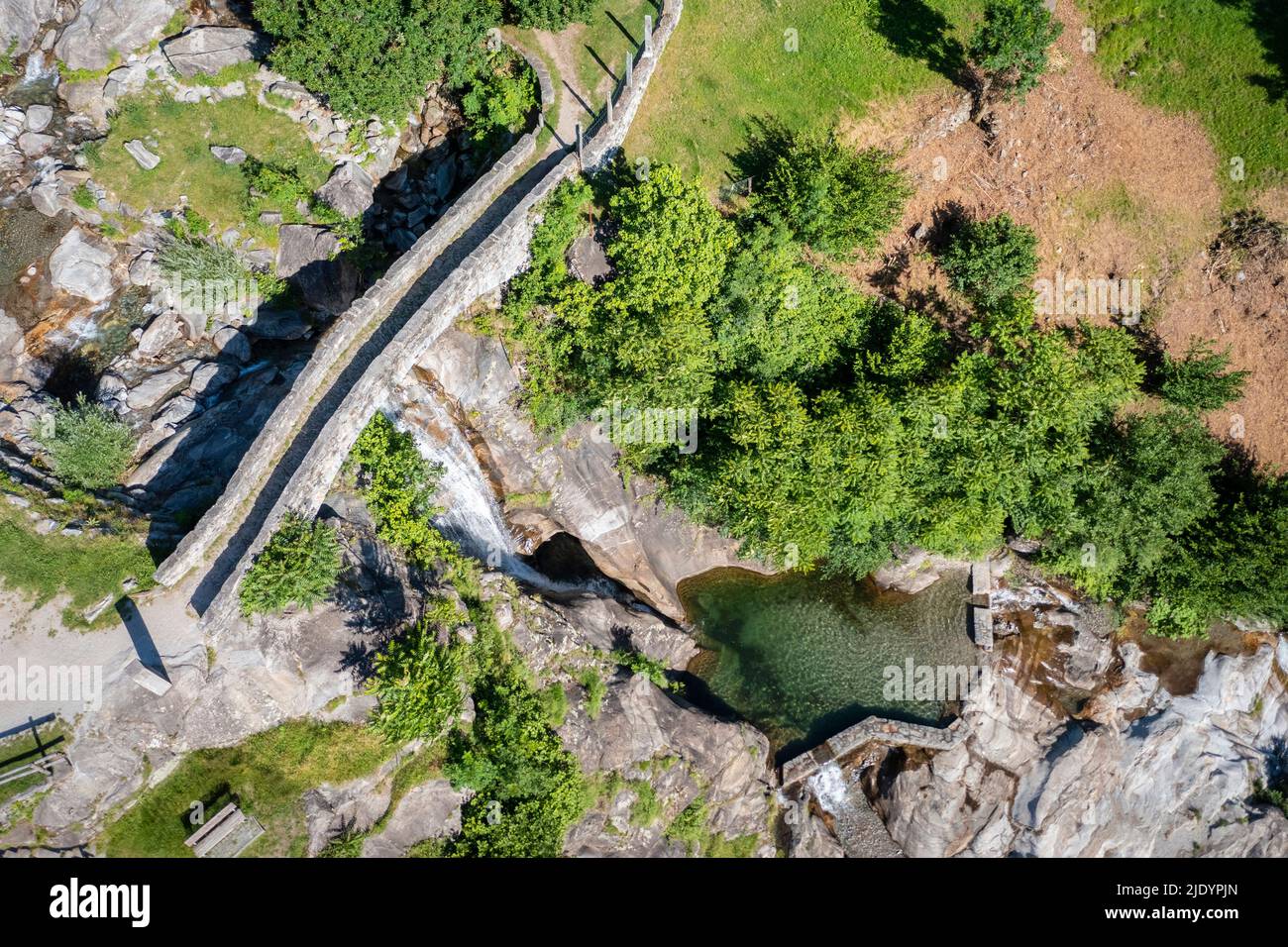 Aerial view of the church and waterfall of Santa Petronilla located in Biasca town. Biasca, district of Riviera, Canton of Ticino,Switzerland. Stock Photo