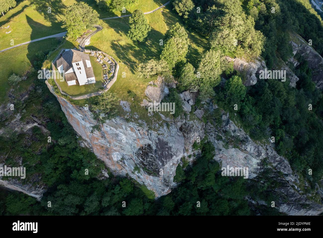 Aerial view of the church of Calonico. Calonico, district of Leventina, Canton of Ticino, Switzerland. Stock Photo