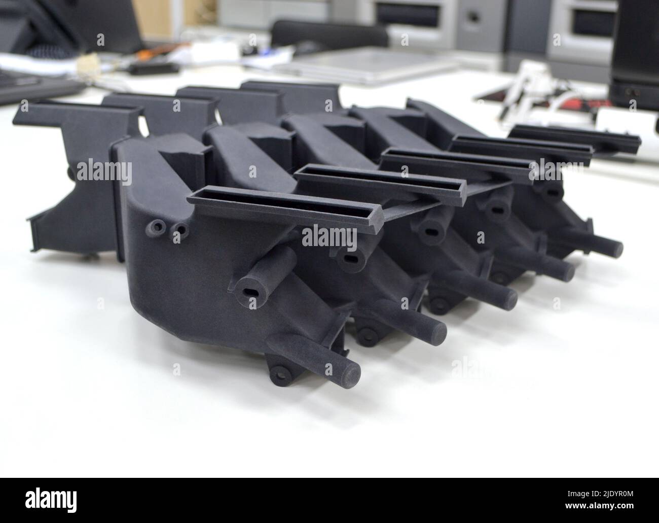 Black model printed on 3D printer in laboratory office. Object printed ...