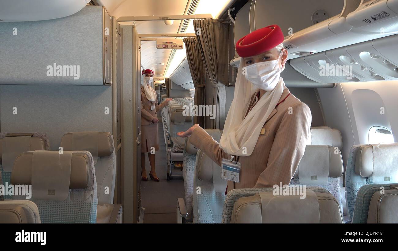 Flight attendants of Dubai's flagship airline Emirates wearing face