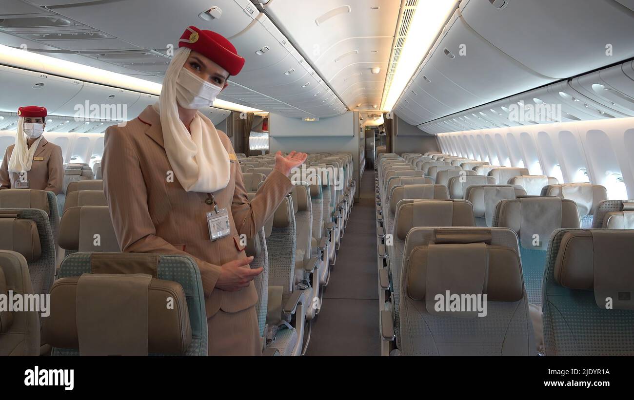 Flight attendants of Dubai's flagship airline Emirates wearing face