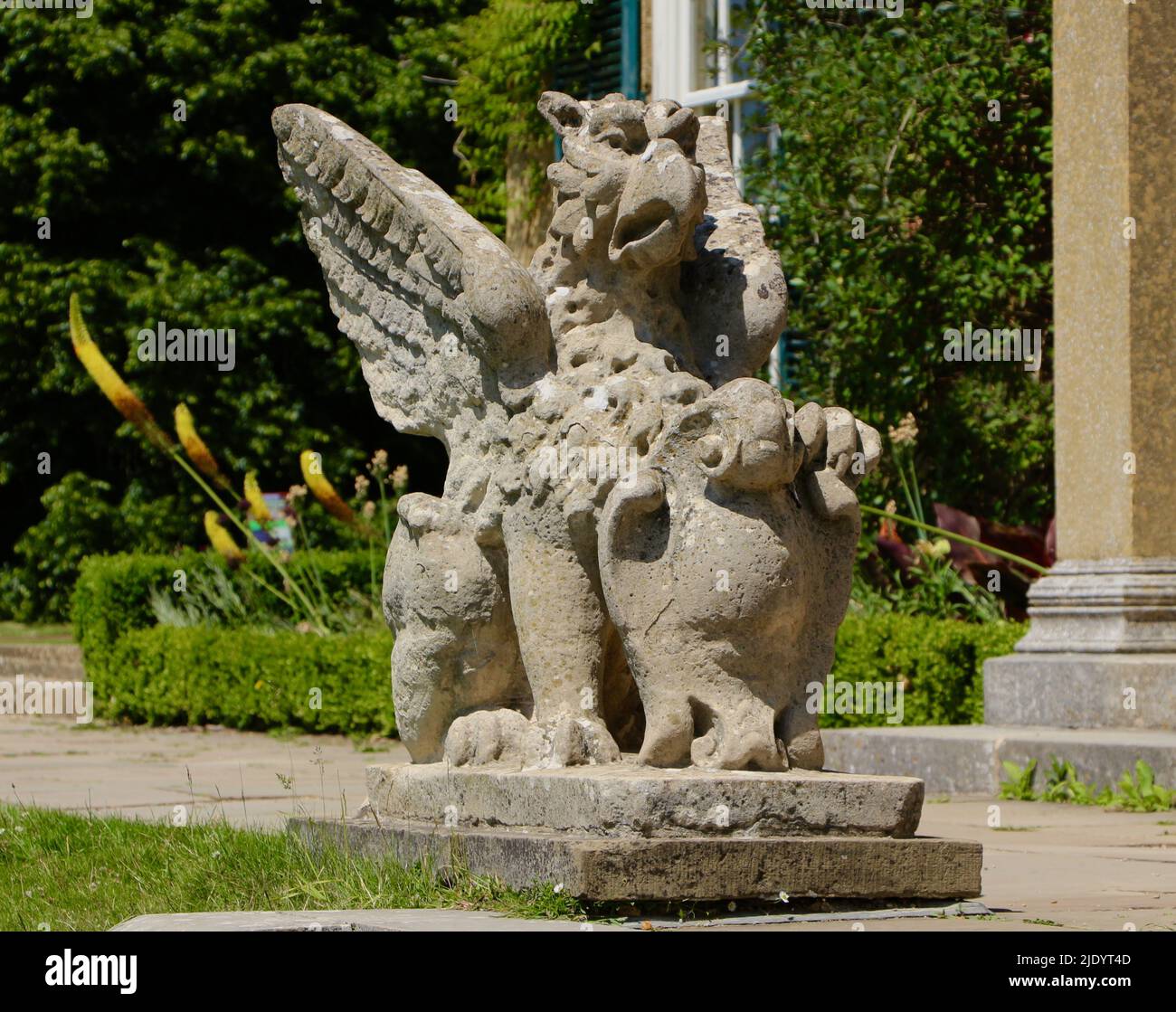 Limestone griffin sculpture in the ornamental gardens at Polesden Lacey