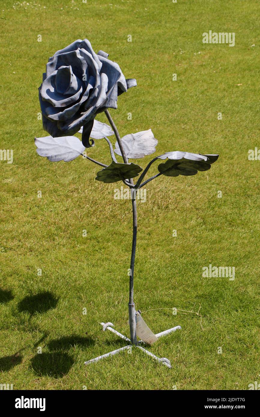 Photo of Galvanised metal rose for sale during the rose festival on the