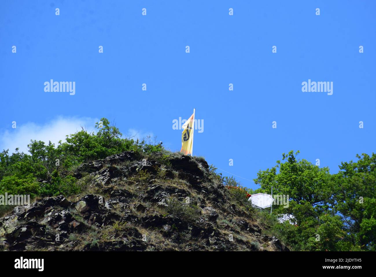 flag on the hill above Cochem Stock Photo Alamy