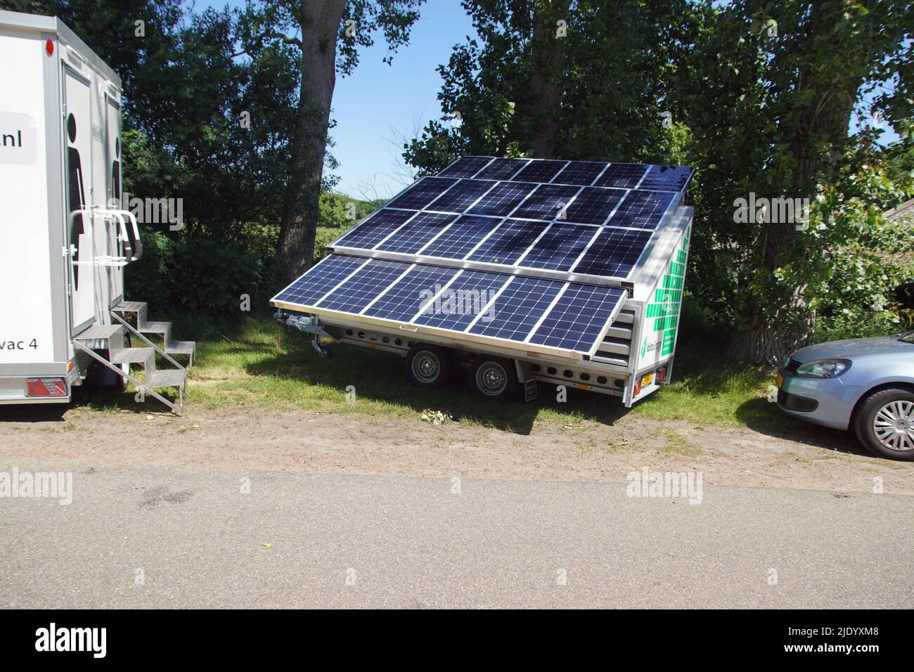 Mobile power generator, solar generator from Volta Energy, with solar panels. For construction. Double portable toilet cabin. June, Netherlands Bergen Stock Photo