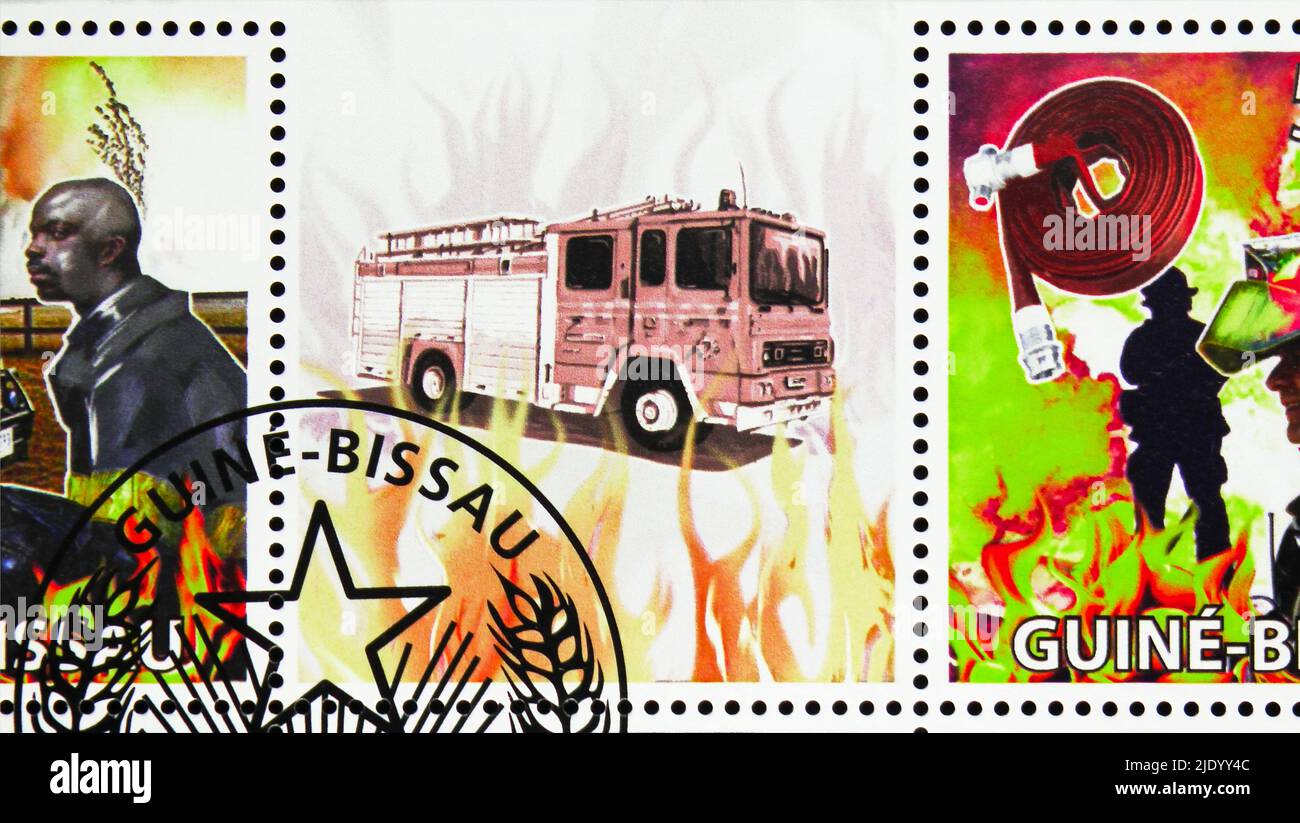 MOSCOW, RUSSIA - JUNE 17, 2022: Postage stamp printed in Guinea-Bissau shows Fire engines and firemen, serie, circa 2009 Stock Photo