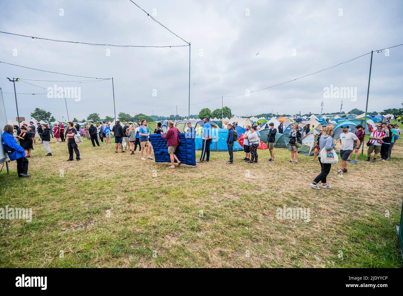 Glastonbury, UK. 24th June, 2022. Queueing for showers is standard