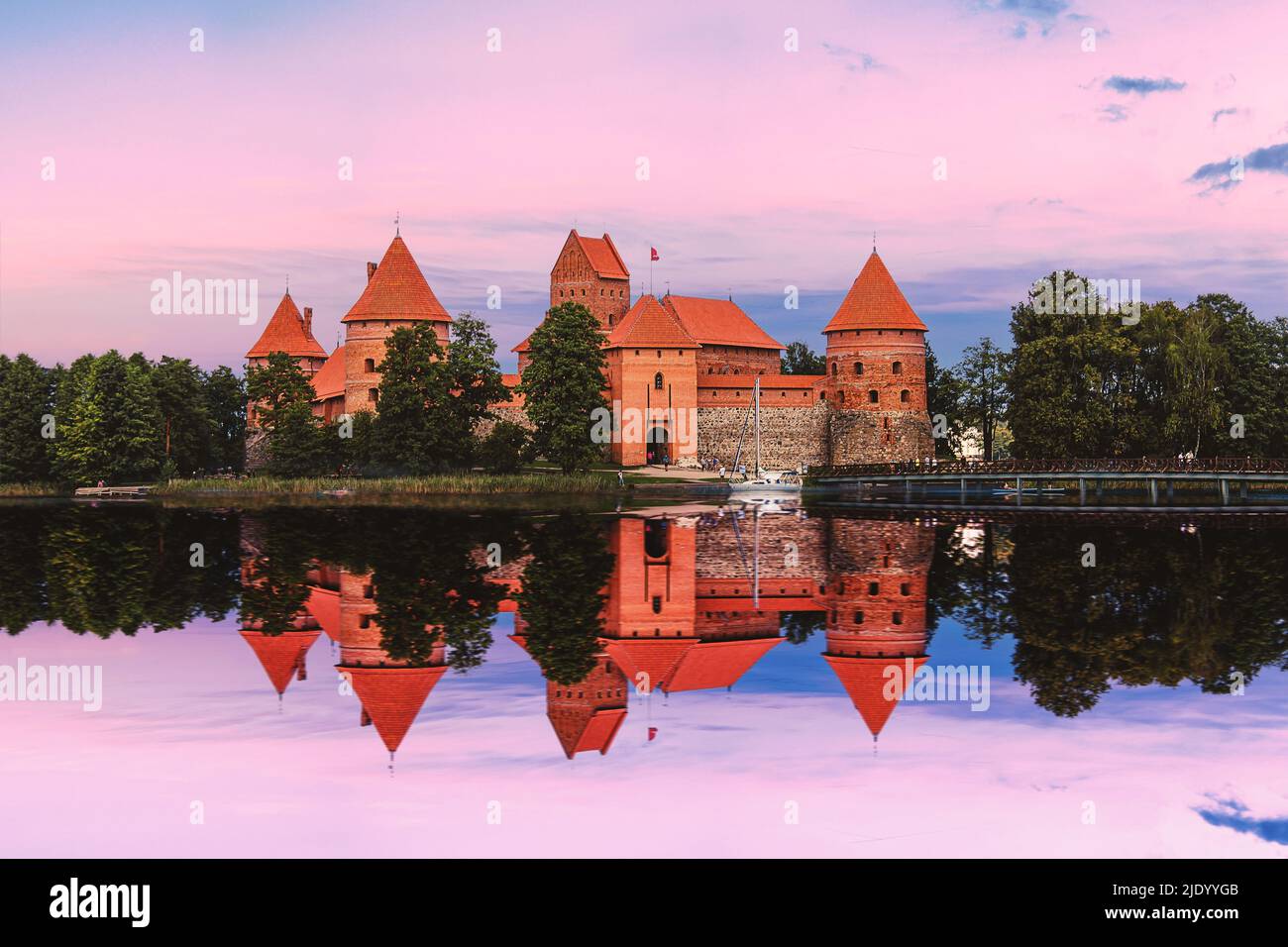 Sunset over Trakai Castle near Vilnius, Lithuania. Island castle reflection in lake. Stock Photo