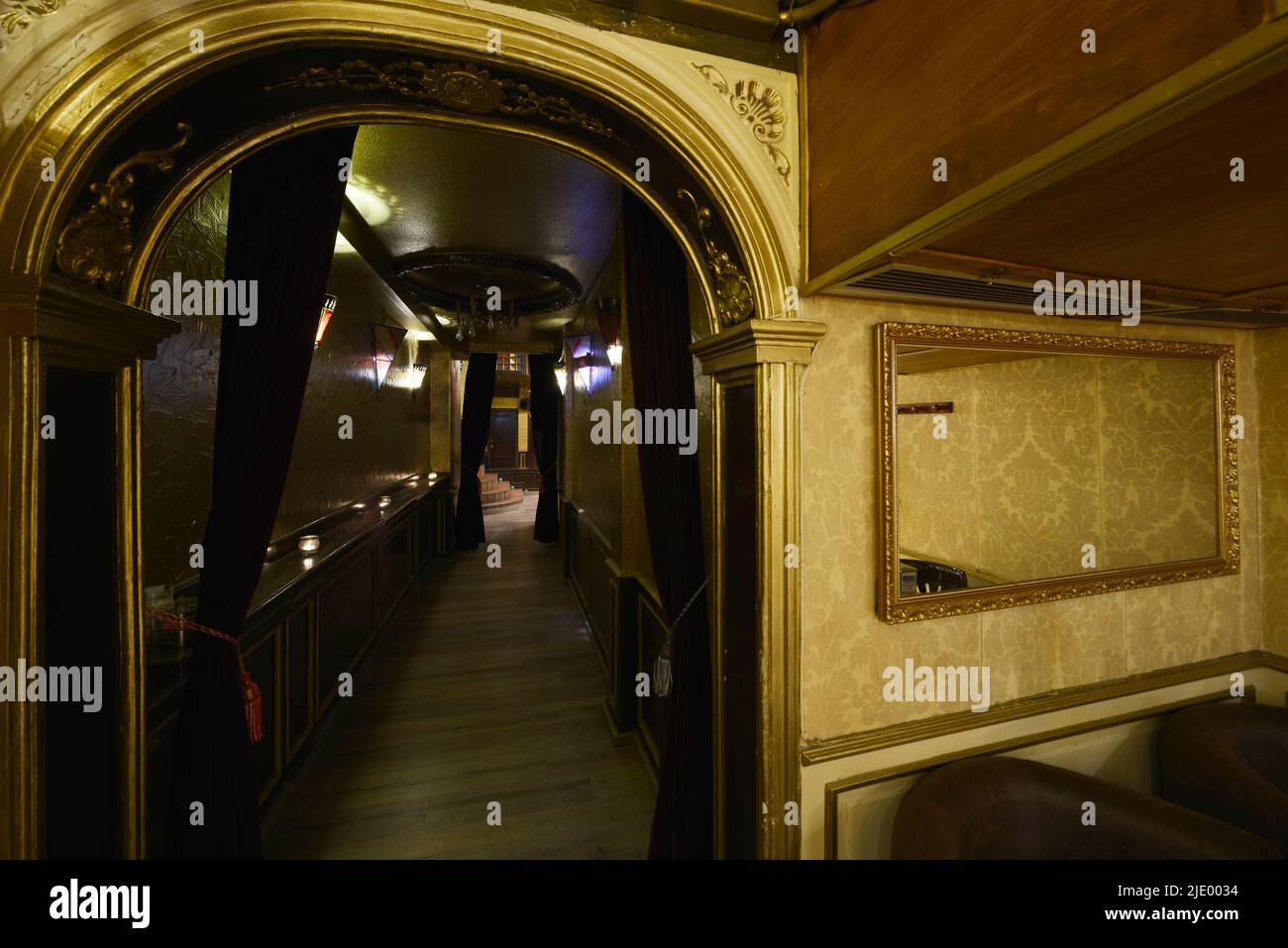 Corridor and reception area with baroque decoration with many golden materials in a nightclub Stock Photo