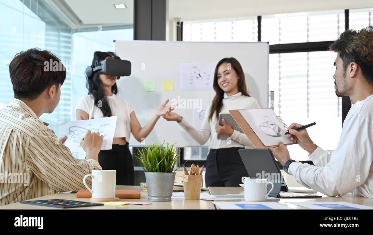 Business team brainstorming and working on virtual reality applications ...