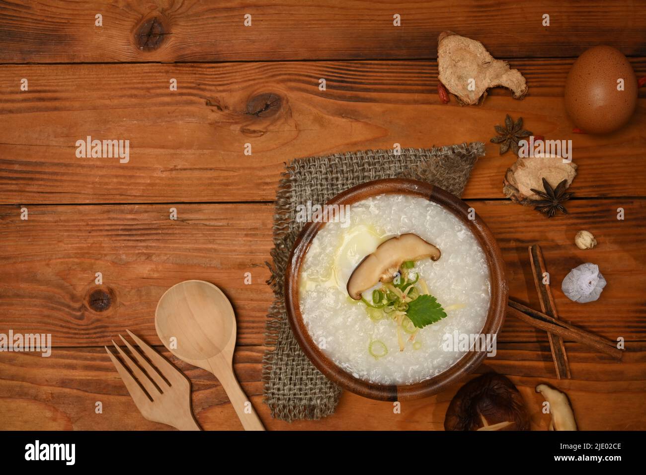 Rice porridge or congee with shiitake mushroom, soft boiled egg, slice
