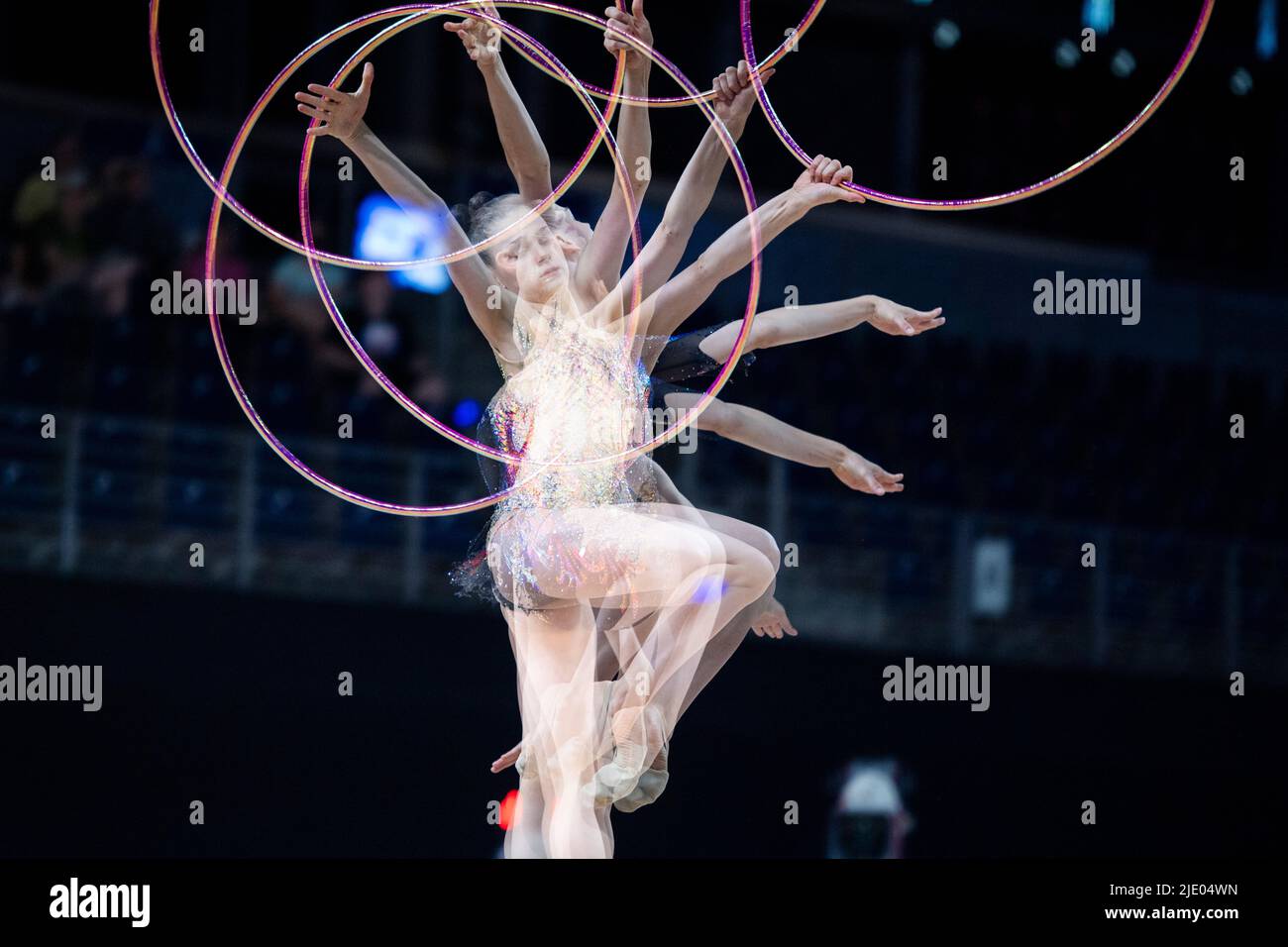 Berlin, Germany. 24th June, 2022. Gymnastics: German Championships, Rhythmic Gymnastics Individual - All-around. Melanie Dargel during her freestyle with the hoop. (Effect by multiple exposure) Credit: Christophe Gateau/dpa/Alamy Live News Stock Photo