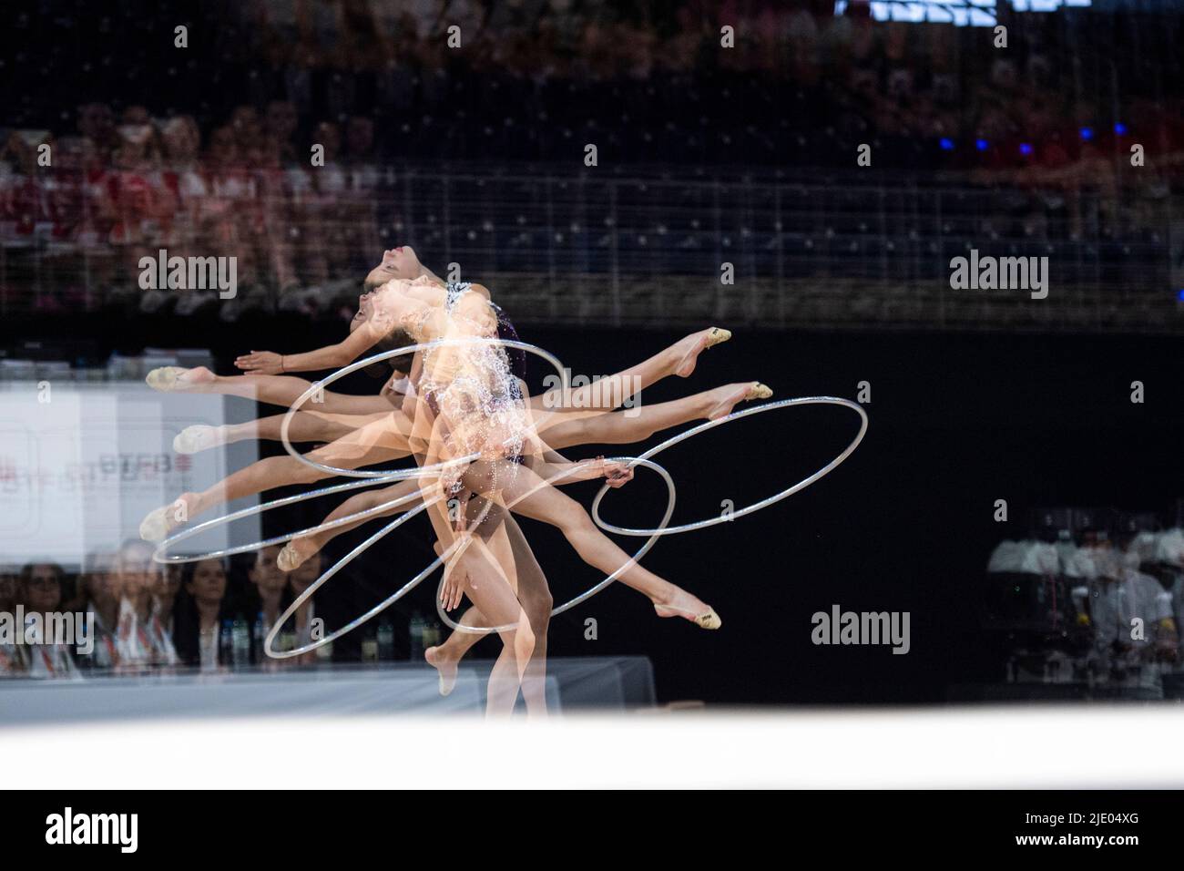 Berlin, Germany. 24th June, 2022. Gymnastics: German Championships, Rhythmic Gymnastics Individual - All-around. Neele Arndt during her freestyle with the hoop. (Effect by multiple exposure) Credit: Christophe Gateau/dpa/Alamy Live News Stock Photo