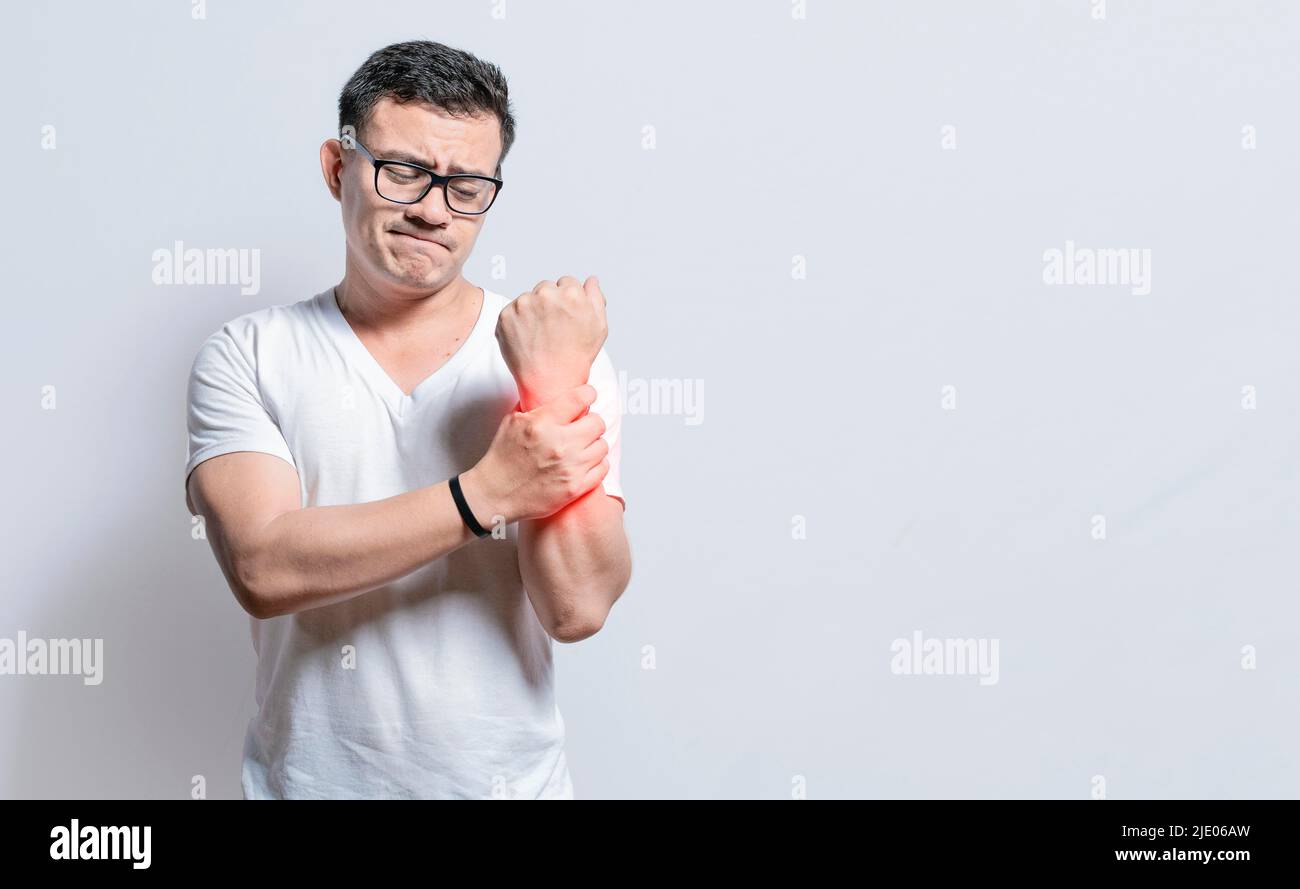 People with wrist pain isolated, Person with wrist pain isolated, Arthritis and wrist pain concept, Arthritis man rubbing, Person with wrist pain Stock Photo