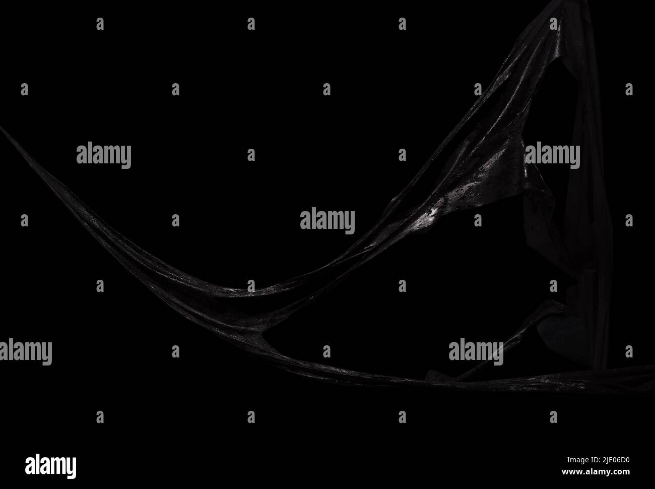 Black symbiote sismucus, sticky slime over dark background Stock Photo